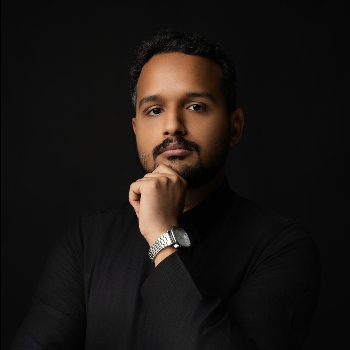 Mohannad Barahma, hand on chin, thinking